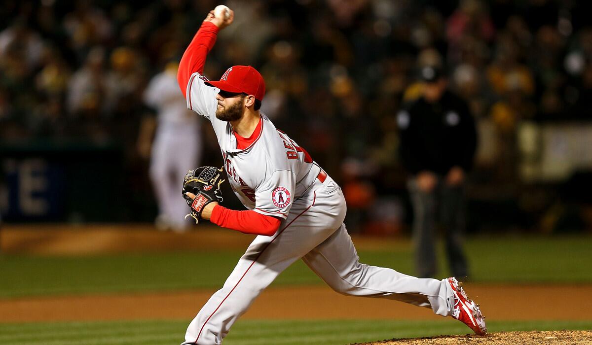 The Angels' Cam Bedrosian pitches against the Oakland A's on April 28. The reliever, waiting in the wings to return to the big leagues, has a 2.19 ERA in seven games for triple-A Salt Lake City. The Angels brought up Ryan Mattheus on Friday.