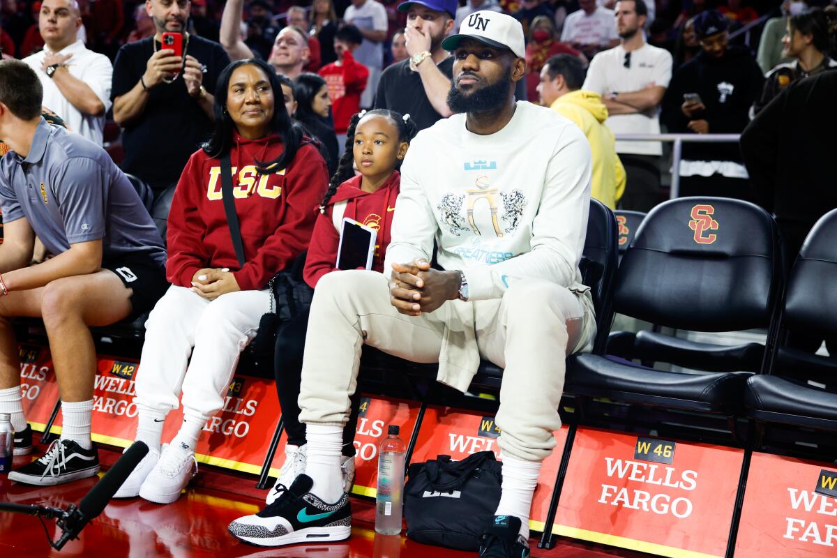 The Lakers' LeBron James watches USC play Long Beach State at the Galen Center in Los Angeles on Dec. 10.