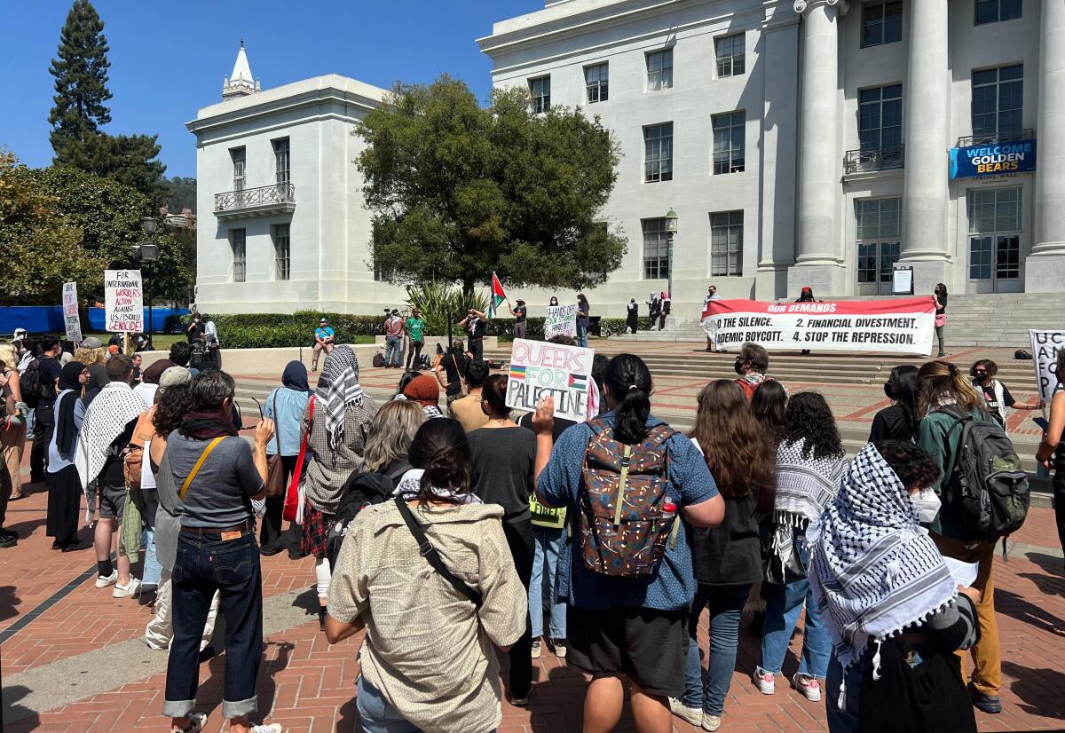 Students gather on a red-brick plaza.