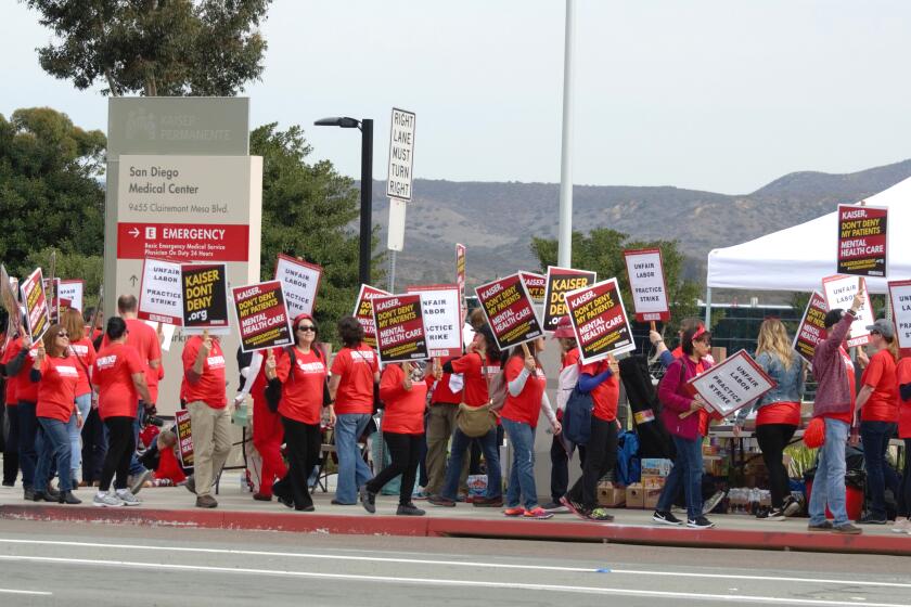 Kaiser therapists strike in front of Kaiser Permanente Medical Center San Diego on Dec. 10, 2018. National Union of Healthcare Workers members staged a similar five-day strike Monday.