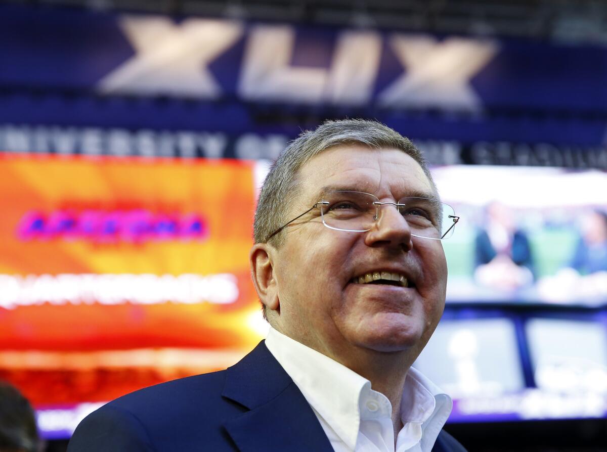 International Olympic Committee President Thomas Bach stands on the field prior to Super Bowl XLIX at University of Phoenix Stadium on Sunday.