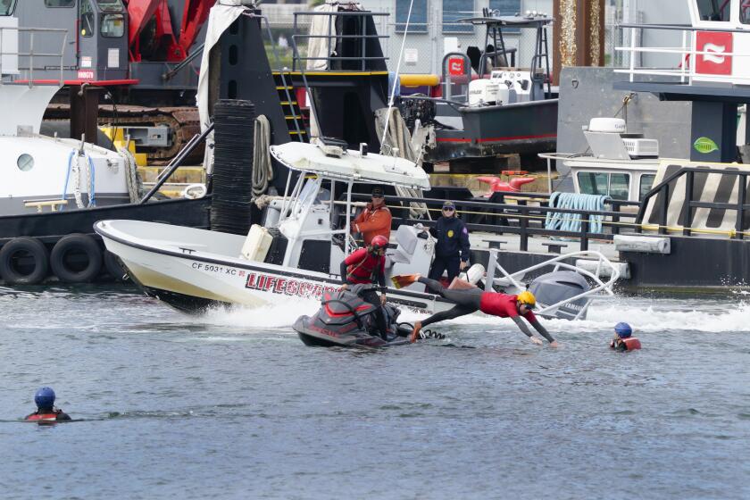 San Diego, CA - April 24: At the annual countywide Mass Rescue Operations exercise held at San Diego Bay on Wednesday, April 24, 2024, lifeguards using their personal water craft, rescue boaters from the water during a simulated vessel fire. Rescue crews from Port of San Diego Harbor Police, Oceanside, San Diego, Coronado, and Solana Beach took part in the exercise to enhance regional coordination and life rescue in San Diego Bay. (Nelvin C. Cepeda/The San Diego Union-Tribune)
