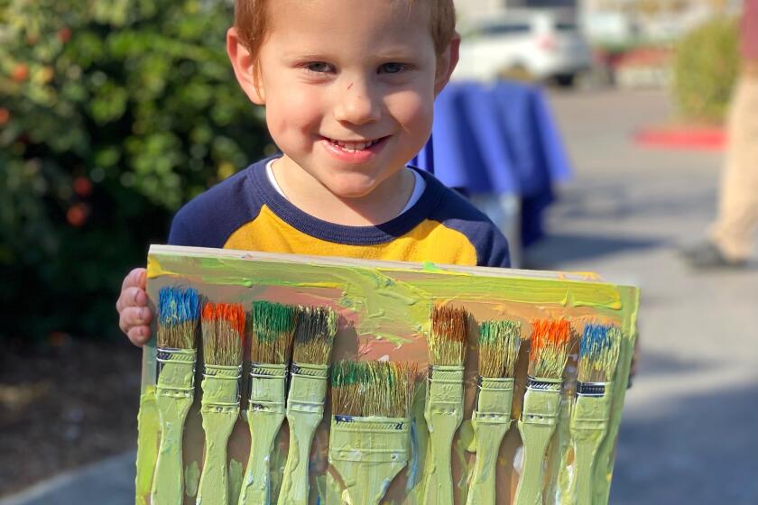 Levi Goldstein holding up his completed project.