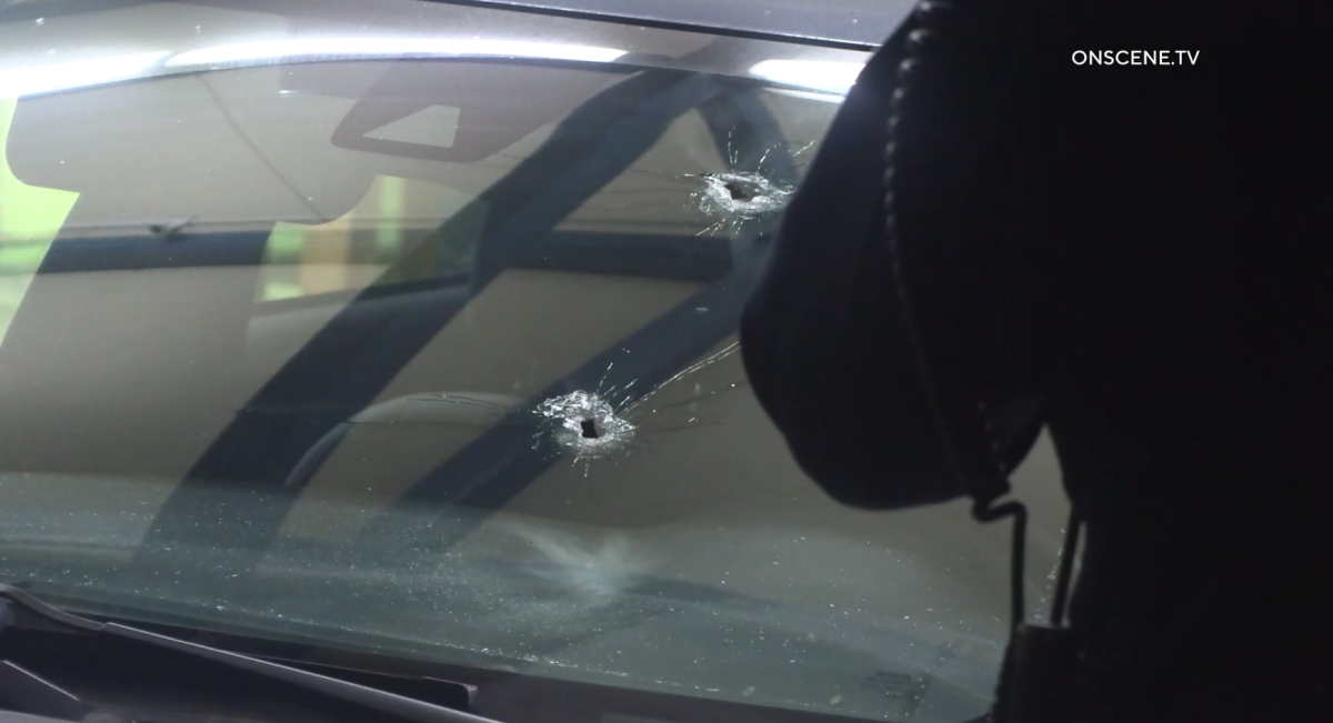 San Diego police were investigating after a bullet grazed a woman's cheek in a car headed down an Otay Mesa-area street.