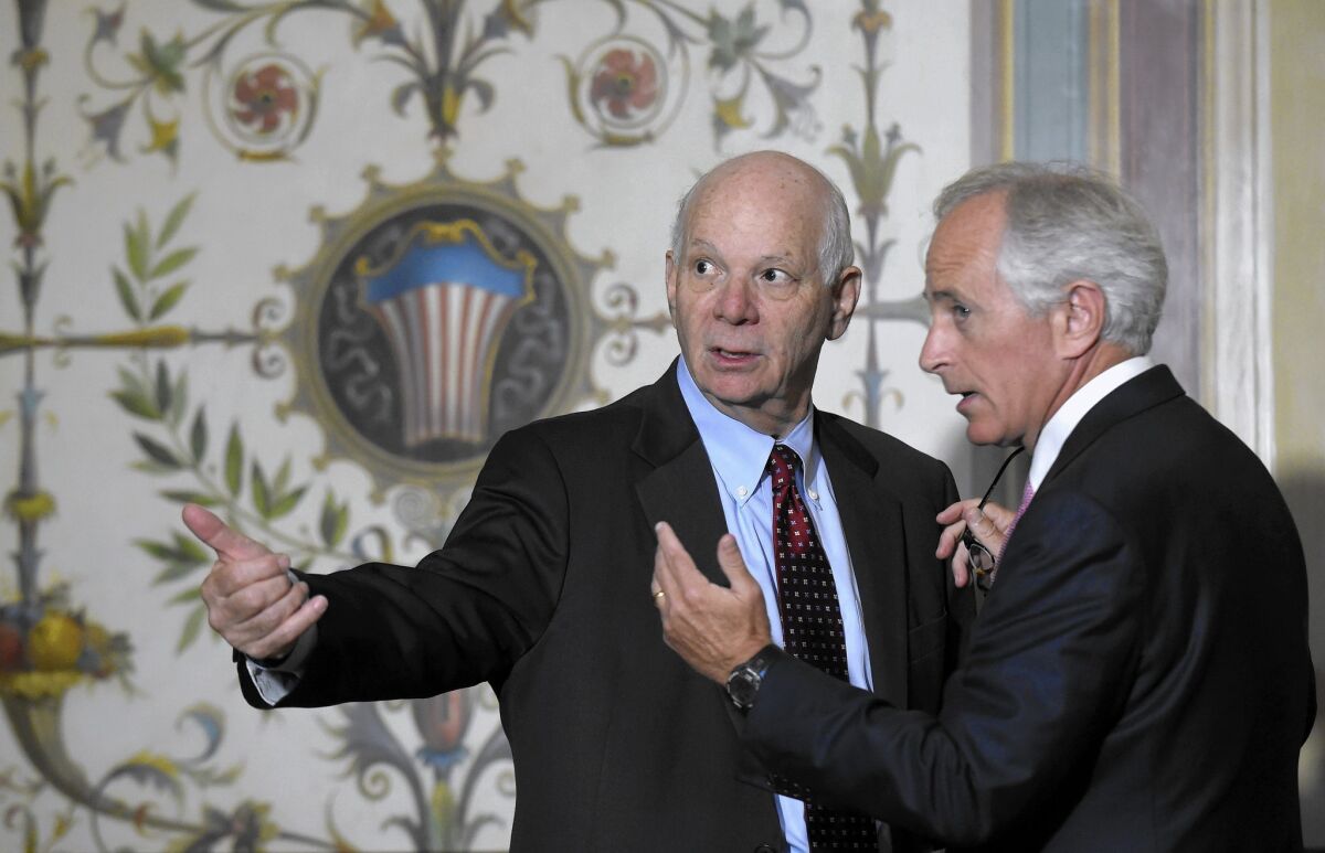 Sen. Benjamin Cardin (D-Md.), left, and Sen. Bob Corker (R-Tenn.) talk on Capitol Hill on July 16 after Vice President Joe Biden met with senators to push the Iran nuclear deal.