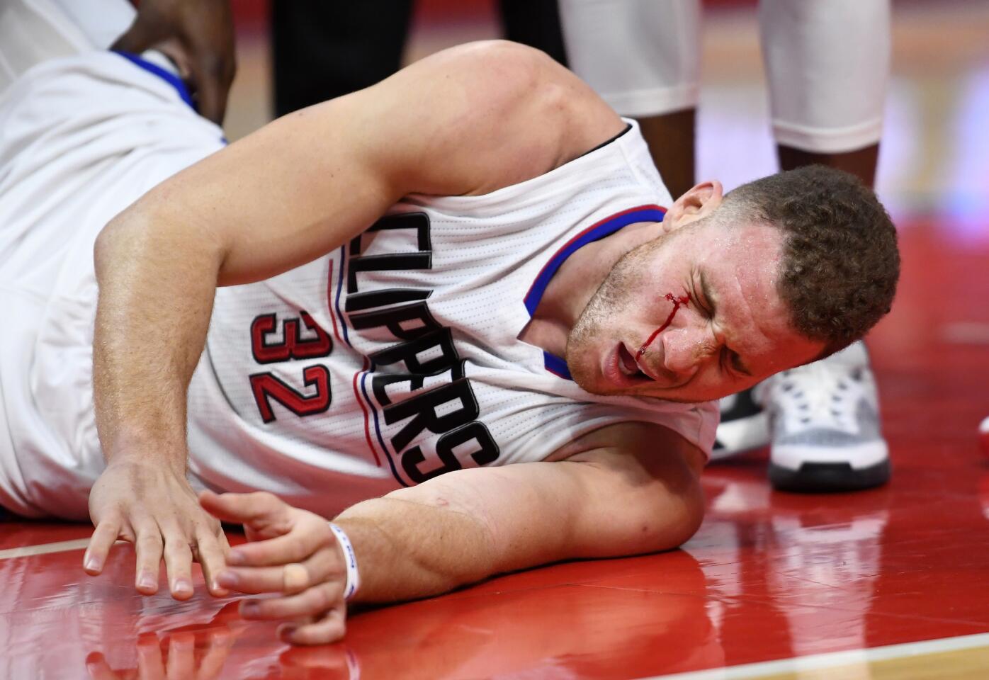 Clippers forward Blake Griffin writhes on the court after being fouled during the second half.