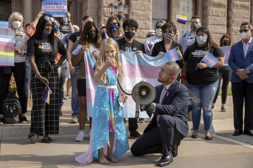 Kai Shappley, 10, of Austin, speaks at a rally against House Bill 25, a bill that would ban transgender girls from participating in girls school sports, outside the Capitol in Austin, Texas, on Wednesday, Oct. 6, 2021. (Jay Janner/Austin American-Statesman via AP)