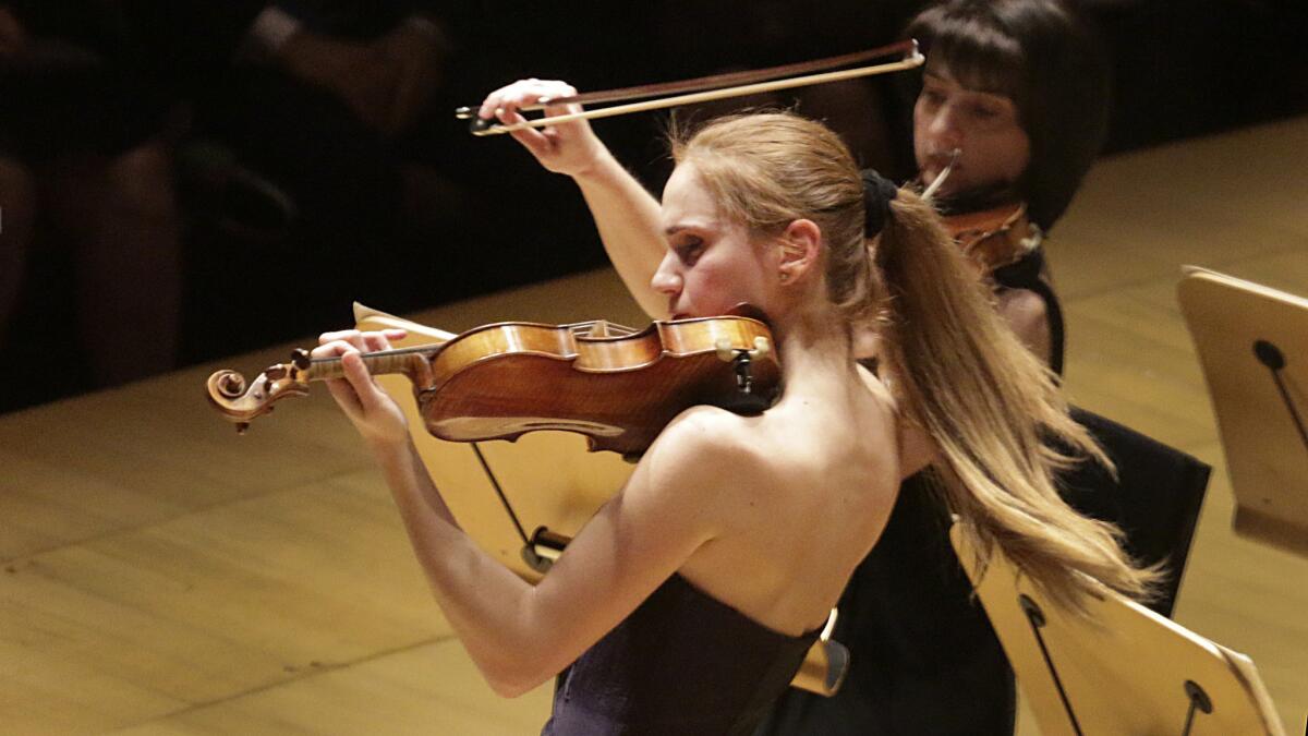 Anush Nikoghosyan's hair gets into the act during her violin solo with the Armenian National Philharmonic Orchestra at Disney.