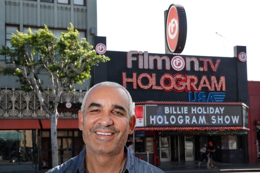 HOLLYWOOD, CALIF. -- FRIDAY, SEPT. 22, 2017: Billionaire Alki David and a view of the exterior of Hologram USA Theater on Hollywood Blvd. in Hollywood. Controversial billionaire Alki David has been trying to get this hologram theater in Hollywood off the ground for more than a year. The technology is the creepy stuff that brought Tupac and Michael Jackson back to life, and Whitney Houston. (Allen J. Schaben / Los Angeles Times)