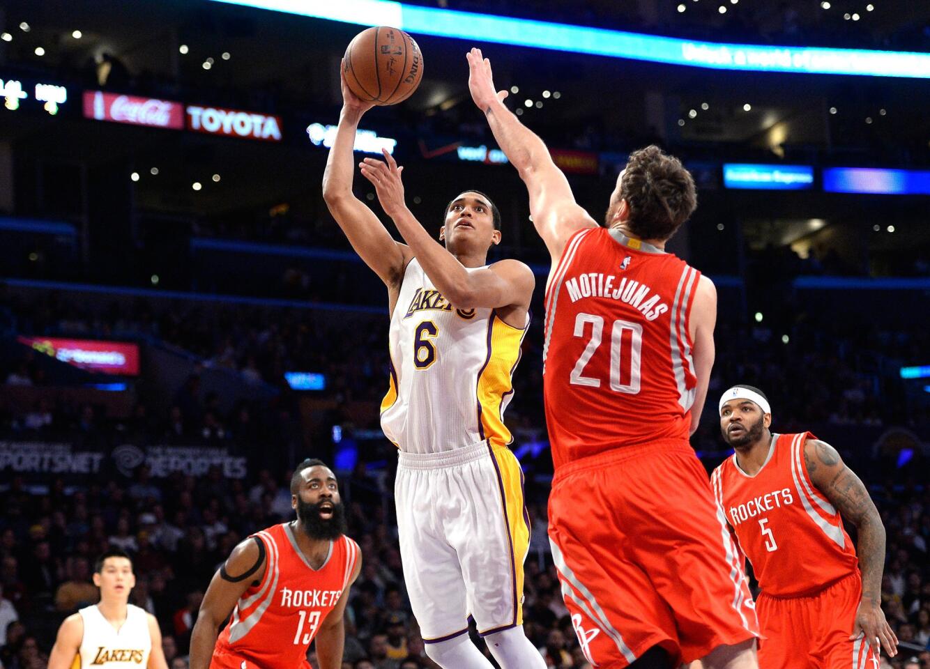 Lakers guard Jordan Clarkson scores over Rockets forward Donatas Motiejunas in the second half.