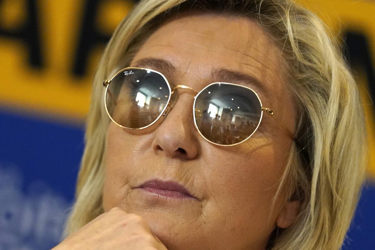 FILE - In this June 17, 2021 file photo, far-right leader Marine le Pen looks on during a press conference in Toulon, southern France. French far-right leader Marine Le Pen is coming under biting criticism from current and former supporters for taking her anti-immigration National Rally too mainstream, with some suggesting the strategy could cost her next year's presidential race. (AP Photo/Daniel Cole, File)