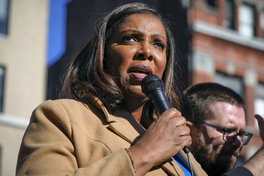 FILE - New York Attorney General Letitia James speaks during a rally in support of home care workers in New York, Tuesday, Dec. 14, 2021. Former President Donald Trump recently told a mostly white crowd at a rally in Texas that his legal troubles are the fault of Black prosecutors he called racists. Trump repeated his charges of racism to underscore his contention that he couldn’t possibly be treated fairly by Black officials who are leading Trump investigations in New York and Georgia. (AP Photo/Seth Wenig, File)