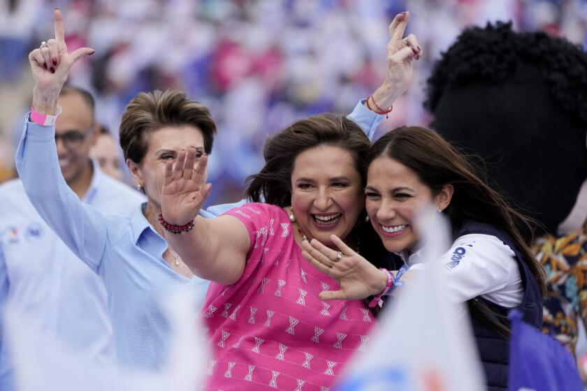 FILE - Presidential candidate Xóchitl Galvez, center, greets supporters during her opening campaign rally in Irapuato, Mexico, March 1, 2024. She represents a coalition that includes the PRI, which governed Mexico for 71 years, and she began her campaign as a political phenomenon backed by the country's business elites. (AP Photo/Fernando Llano, File)