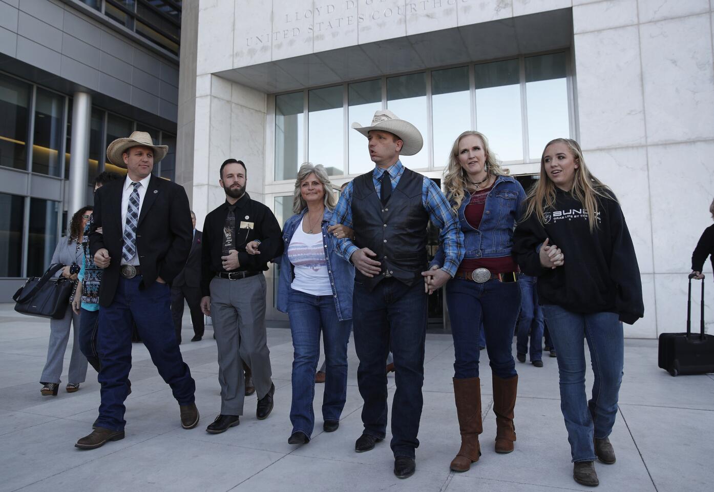 From left, Ammon Bundy, Ryan Payne, Jeanette Finicum, widow of Robert "LaVoy" Finicum, Ryan Bundy, Angela Bundy, wife of Ryan Bundy and Jamie Bundy, daughter of Ryan Bundy, walk out of a federal courthouse in Las Vegas. Chief U.S. District Judge Gloria Navarro declared a mistrial in the case against Cliven Bundy, his sons Ryan and Ammon Bundy and self-styled Montana militia leader Ryan Payne.