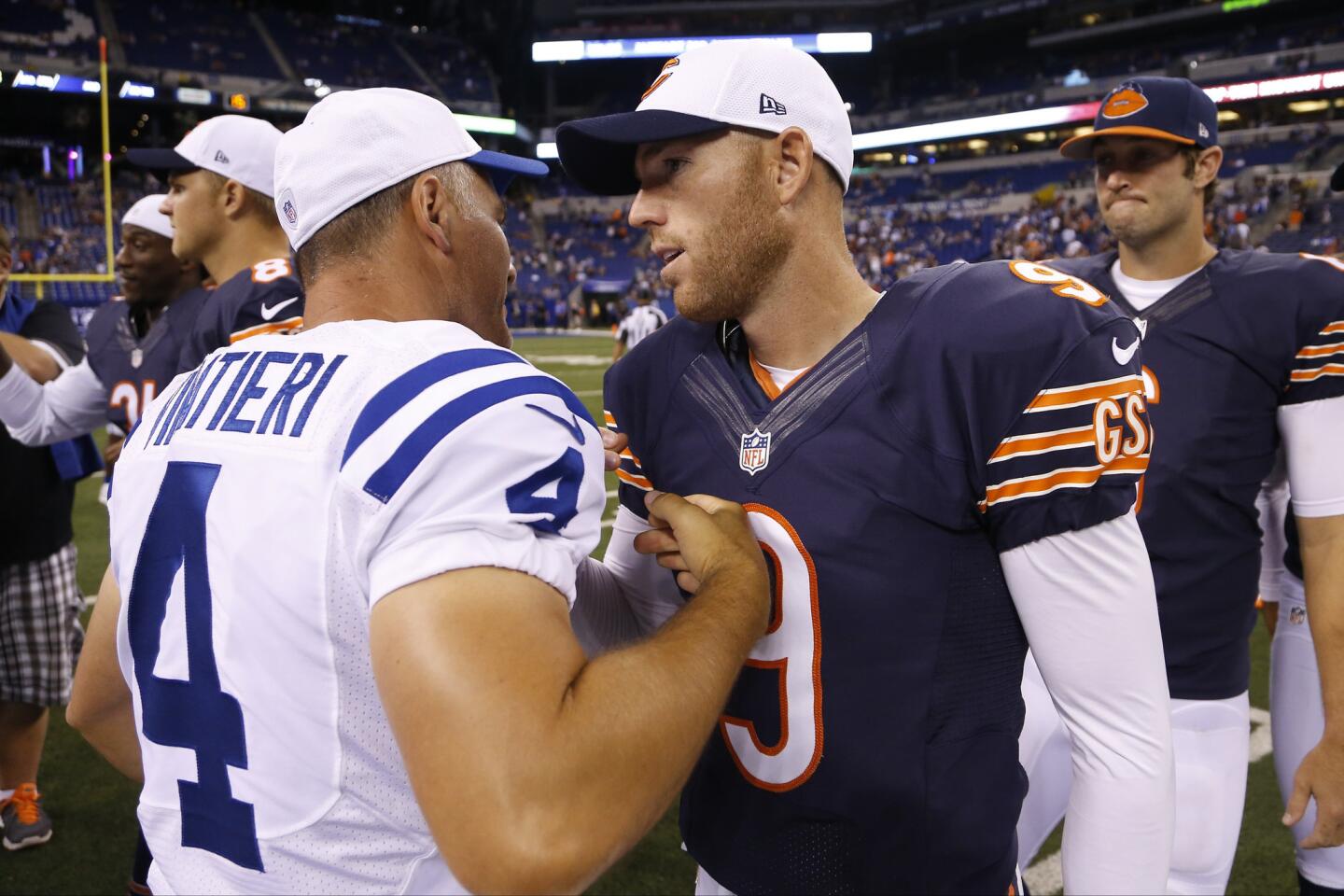 Colts kicker Adam Vinatieri greets Bears kicker Robbie Gould after a preseason game in Indianapolis.