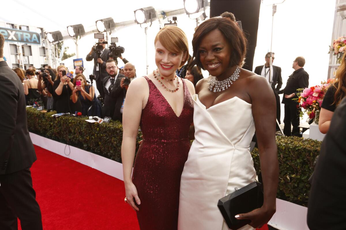 Bryce Dallas Howard, left, a nominee for "Black Mirror," and Viola Davis, a nominee for "Fences," arrive at the 23rd Screen Actors Guild Awards at the Shrine Auditorium.