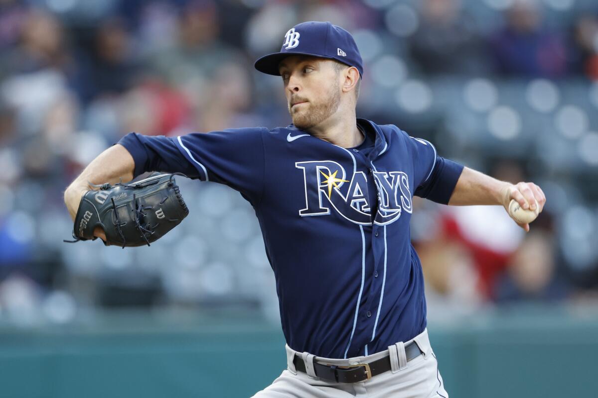 Tampa Bay Rays pitcher Jason Adam, left, and catcher Christian