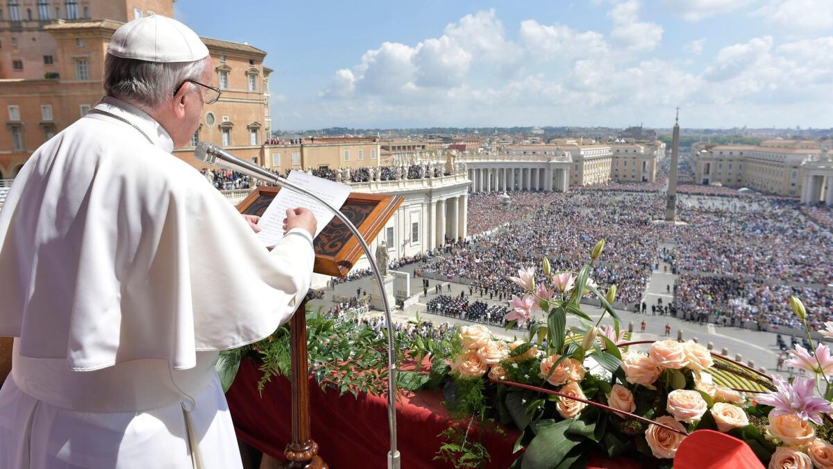 Pope Francis during the "Urbi et Orbi" blessing for Rome and the world from St. Peters' Basilica after Easter Mass.