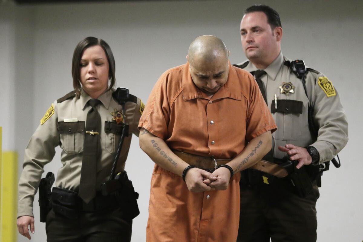 Julio Acevedo is escorted to a hearing at the Lehigh County Courthouse in Allentown, Pa. He waived extradition to New York.