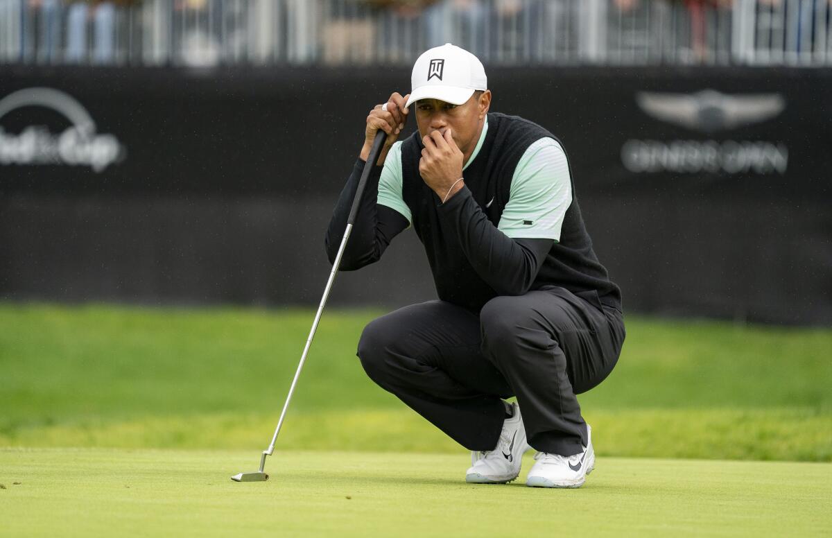 Tiger Woods lines up a putt on the 14th green during the second day of the previously called Genesis Open at Riviera Country Club in 2019.