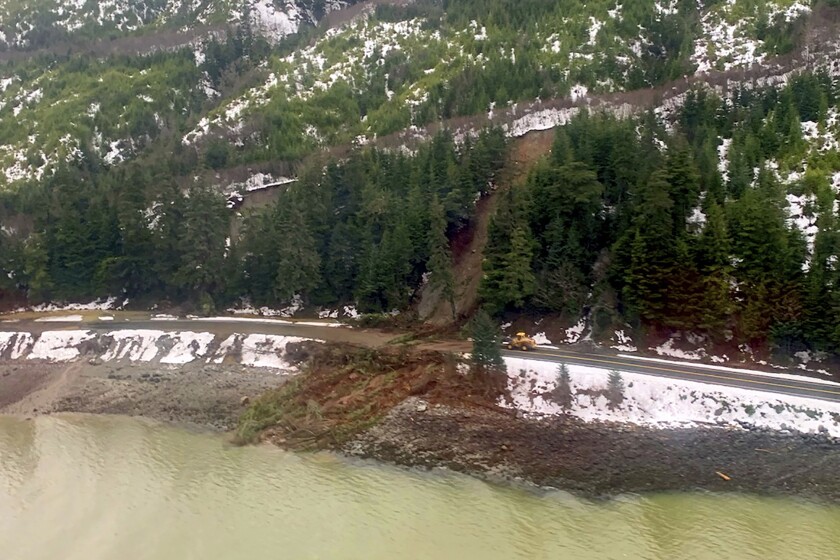 This photo from the U.S. Coast Guard shows where a rainstorm caused landslides in Haines, Alaska, Thursday, Dec. 3, 2020. Authorities have identified the two people missing after a landslide the width of two football fields slammed into the southeast Alaska community. The Coast Guard remains engaged with the Alaska State Troopers and the city of Haines while responding to this event. (Lt. Erick Oredson/U.S. Coast Guard via AP)