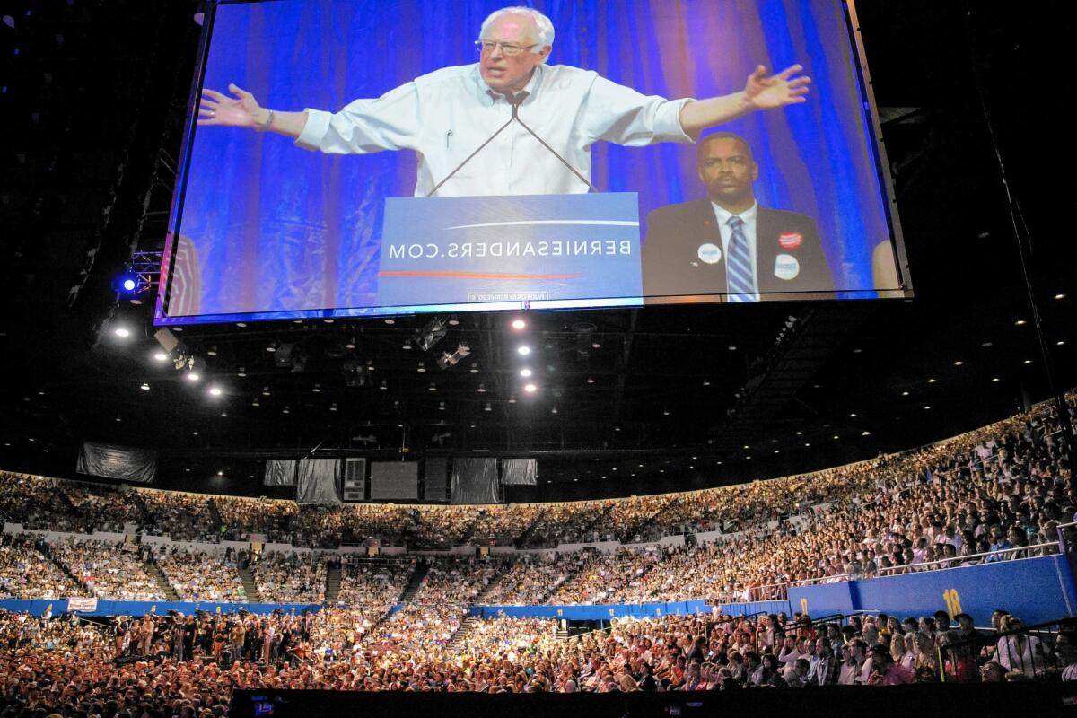 Presidential candidate Bernie Sanders speaks to a sold-out crowd at the Los Angeles Memorial Sports Arena on Monday night.