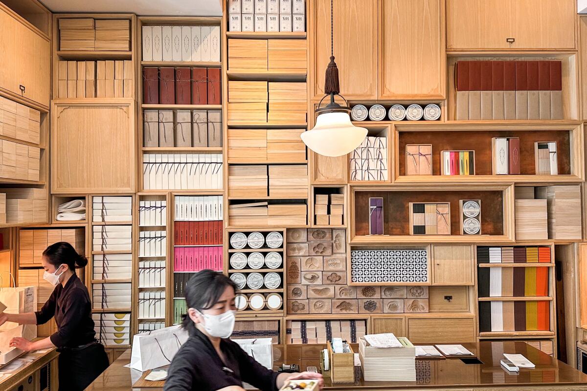 Staffers wrap confections in the front area of Higashiya in Tokyo's Ginza district. 