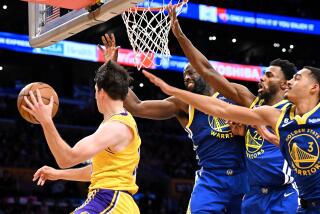 Los Angeles, California May 12, 2023-Lakers Austin Reaves gets a pass off despite defensive pressure.