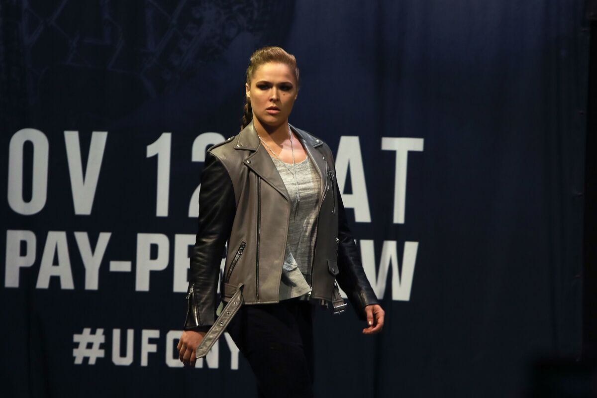 Ronda Rousey walks on stage for her face-off with UFC Women's Bantamweight Champion Amanda Nunes in preparation for their UFC 207 fight that will take place on Friday.