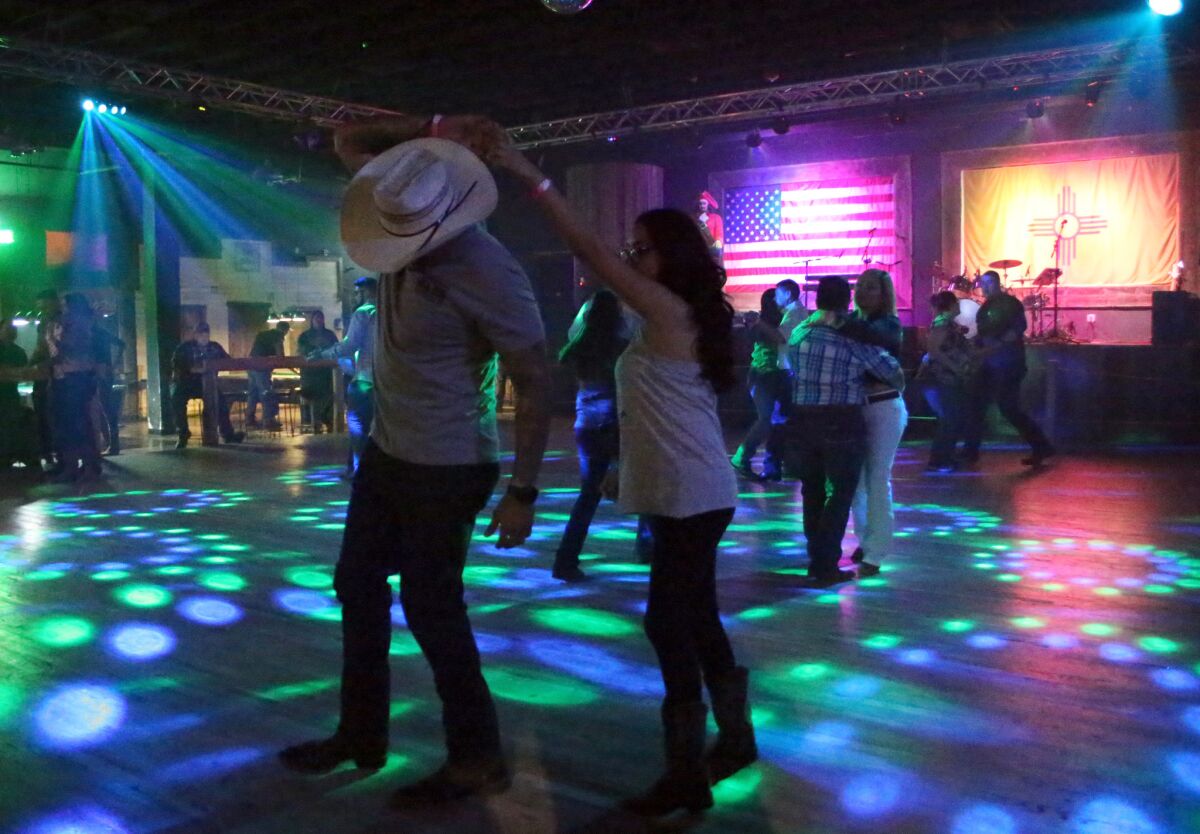 Dancers take to the floor at Whiskey Dicks nightclub in Las Cruces, N.M.