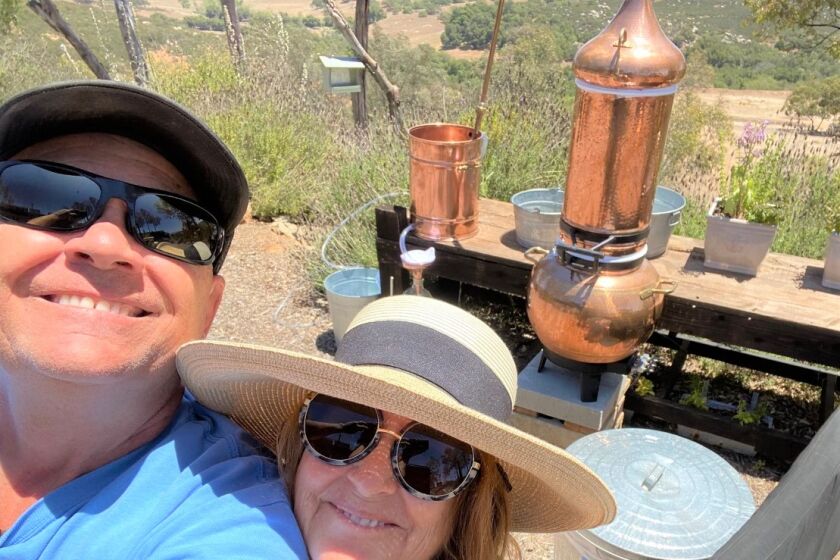 Laurie Miller with husband, Van, on their Escondido ranch preparing to distill lavender for her skin care line, Nani Pua.