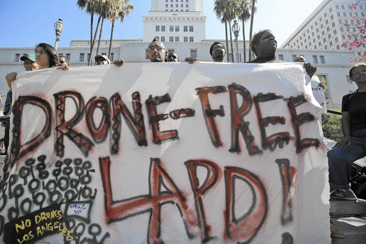 The Stop LAPD Spying Coalition holds a news conference outside L.A. City Hall in August. Gov. Brown on Sunday vetoed legislation that would have required law enforcement to obtain warrants to use drones for surveillance.