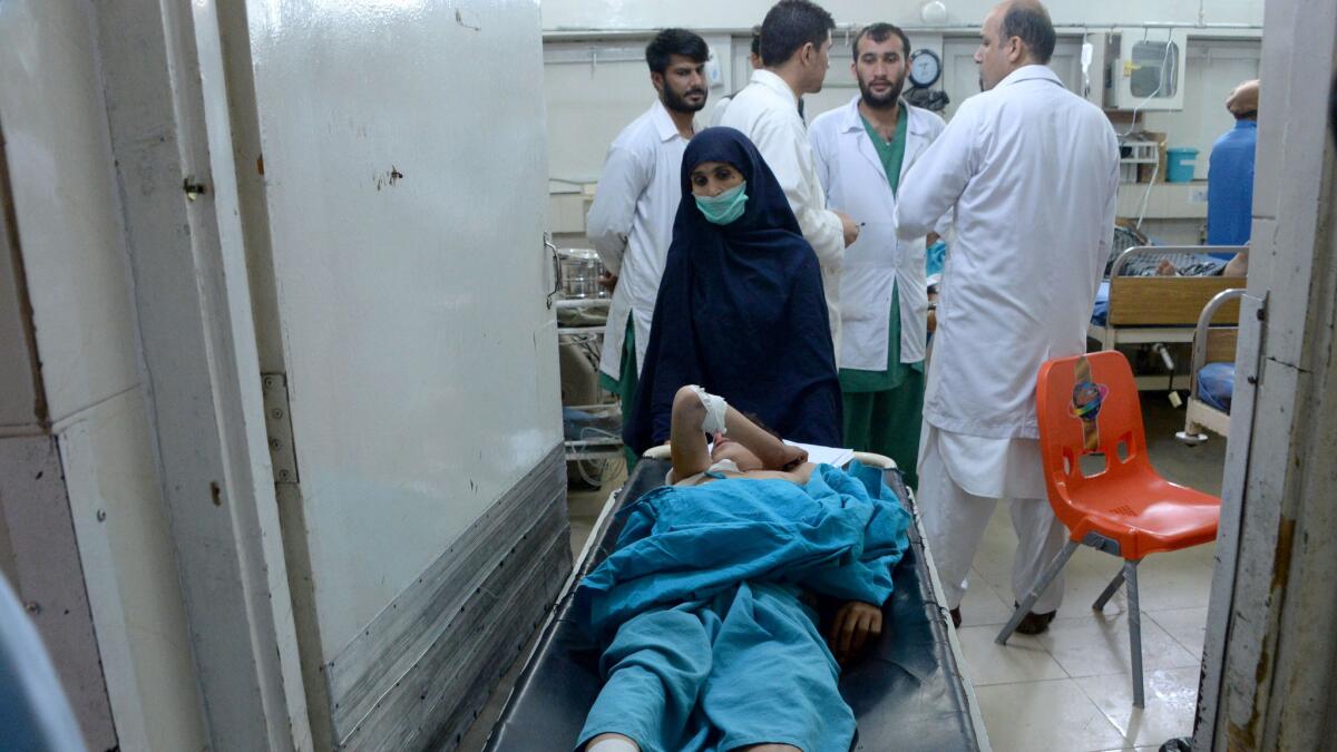An injured Afghan youth receives treatment at a hospital following a suspected U.S. drone airstrike in the Achin district of Nangarhar province on Wednesday.