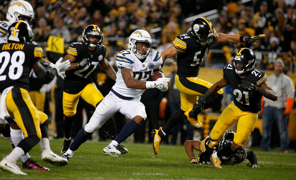 Chargers running back Justin Jackson carries the ball during a game against the Pittsburgh Steelers in December 2018.