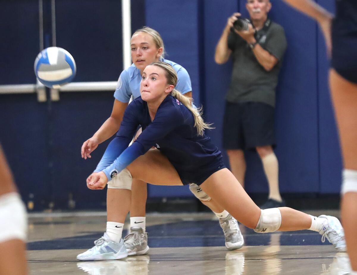 Corona del Mar's Riley Card (3) makes a lunging dig during the Battle of the Bay.