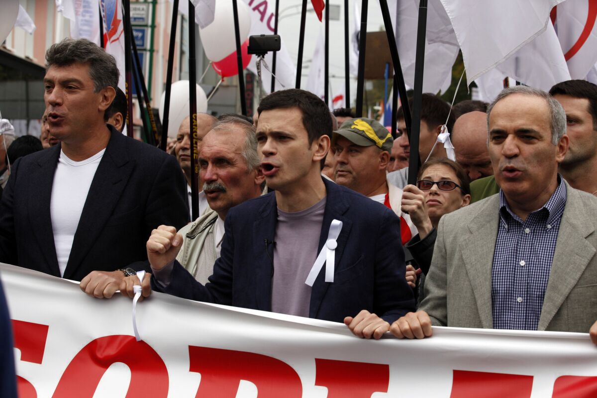From left, Russian opposition activists Boris Nemtsov, Ilya Yashin and Garry Kasparov lead a protest march in downtown Moscow in 2012.