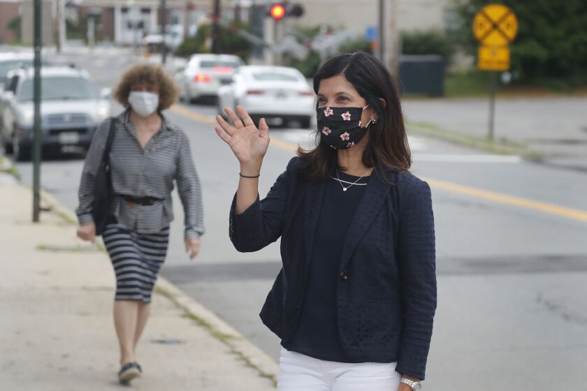 Maine House speaker Sara Gideon, D-Freeport, greets voters near a polling station, Tuesday, July 14, 2020, in Portland, Maine. Gideon is one of three Democrat candidates seeking the party's nomination for U.S. Senate in the July 14 primary. (AP Photo/Elise Amendola)