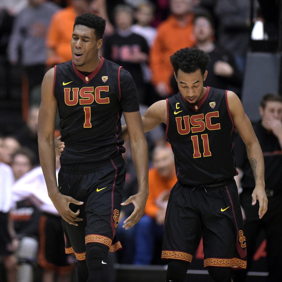USC's Charles Buggs (1) and Jordan McLaughlin (11) walk away from a small scuffle against Oregon State in the second half on Dec. 28.