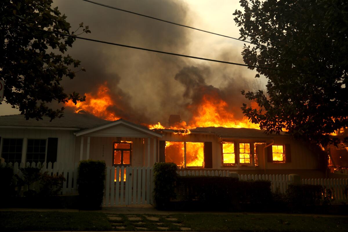 A home is fully engulfed in flames