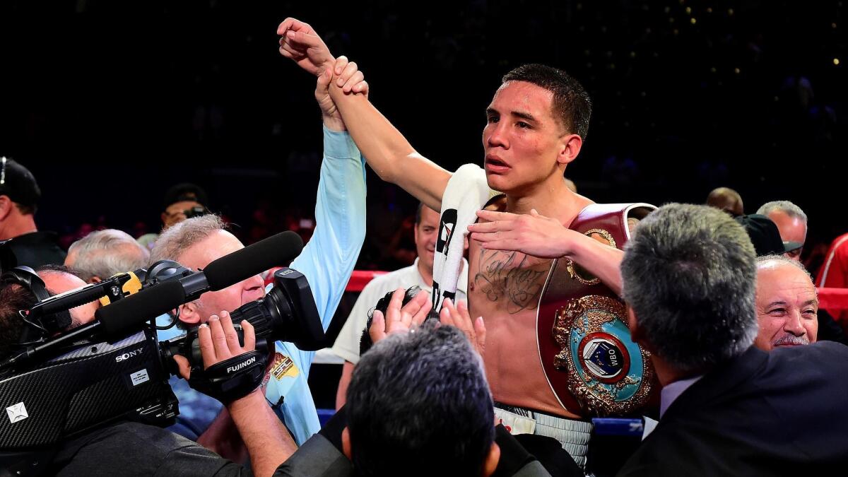 Oscar Valdez celebrates his unanimous 12-round decision over Miguel Marriaga during the WBO Featherweight World Championship bout at StubHub Center on April 22, 2017.