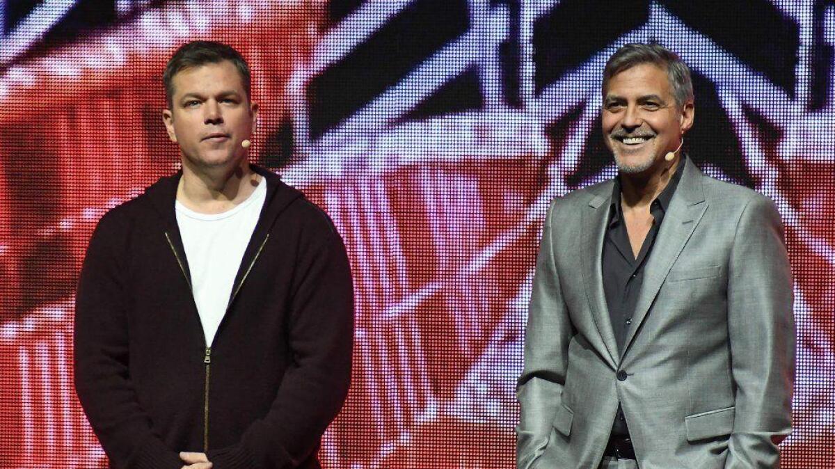 Matt Damon, left, and George Clooney promote "Suburbicon" at CinemaCon.