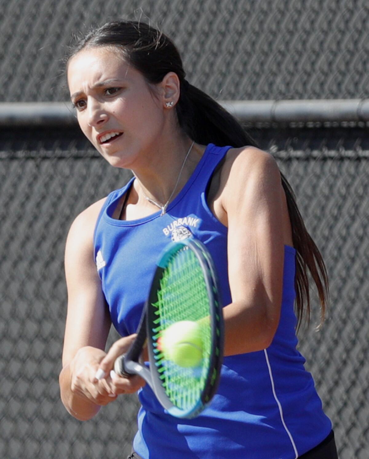 Burbank's Kristina Kirakosyan hits a backhand return against Arcadia in the singles semifinal in the Pacific League girls' tennis semifinals and finals at Burroughs High School on Wednesday, October 30, 2019. A couple of the contests were second-round contests, played today because of poor air quality on Monday.
