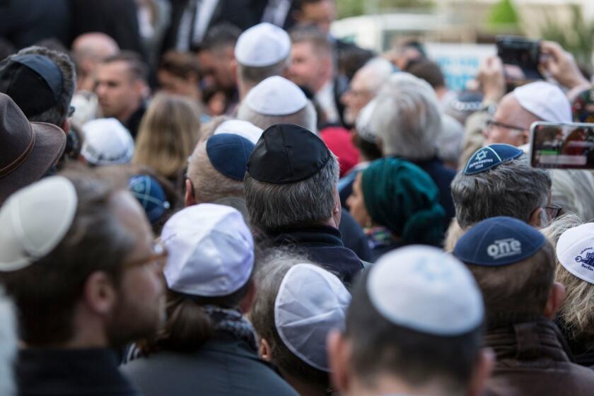 Mandatory Credit: Photo by OMER MESSINGER/EPA-EFE/REX/Shutterstock (9642450h) A participant is wearing a kippa during the 'Berlin wears kippa' near the Jewish community center, in Berlin, Germany, 25 April 2018. Some 2,000 people, may of them wearing a kippa or yarmulke, attended the event that was held in solidarity with the Jewish community. The show of solidarity was organized following an attack on a non-Jewish man wearing a kippa a week ago in Berlin. 'Berlin wears Kippa' event in protest against antisemitic attack in Berlin, Germany - 25 Apr 2018 ** Usable by LA, CT and MoD ONLY **