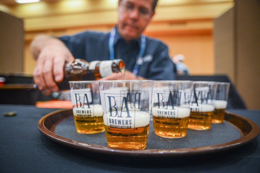 A steward prepares beer samples for judges at the Great American Beer Festival.
