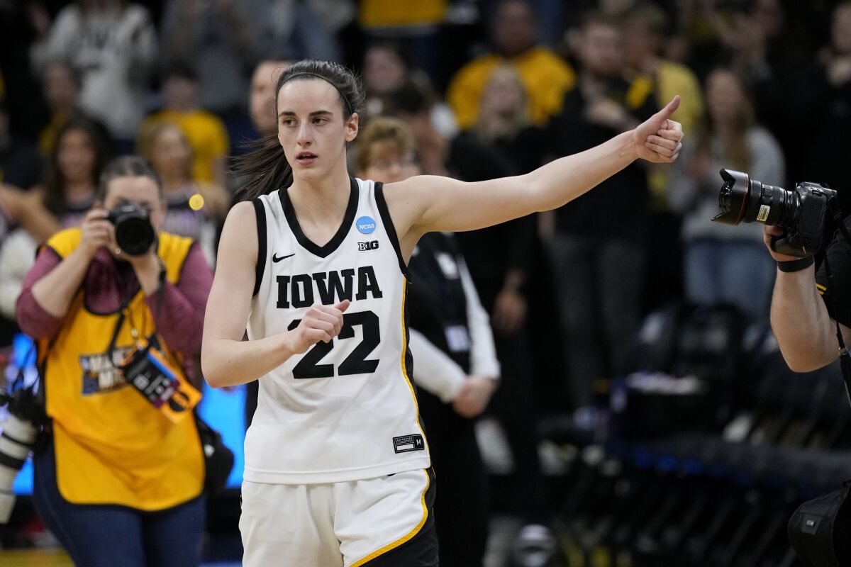 Iowa guard Caitlin Clark celebrates after a second-round college basketball game against Georgia in the NCAA Tournament, Sunday, March 19, 2023, in Iowa City, Iowa. Iowa won 74-66. (AP Photo/Charlie Neibergall)