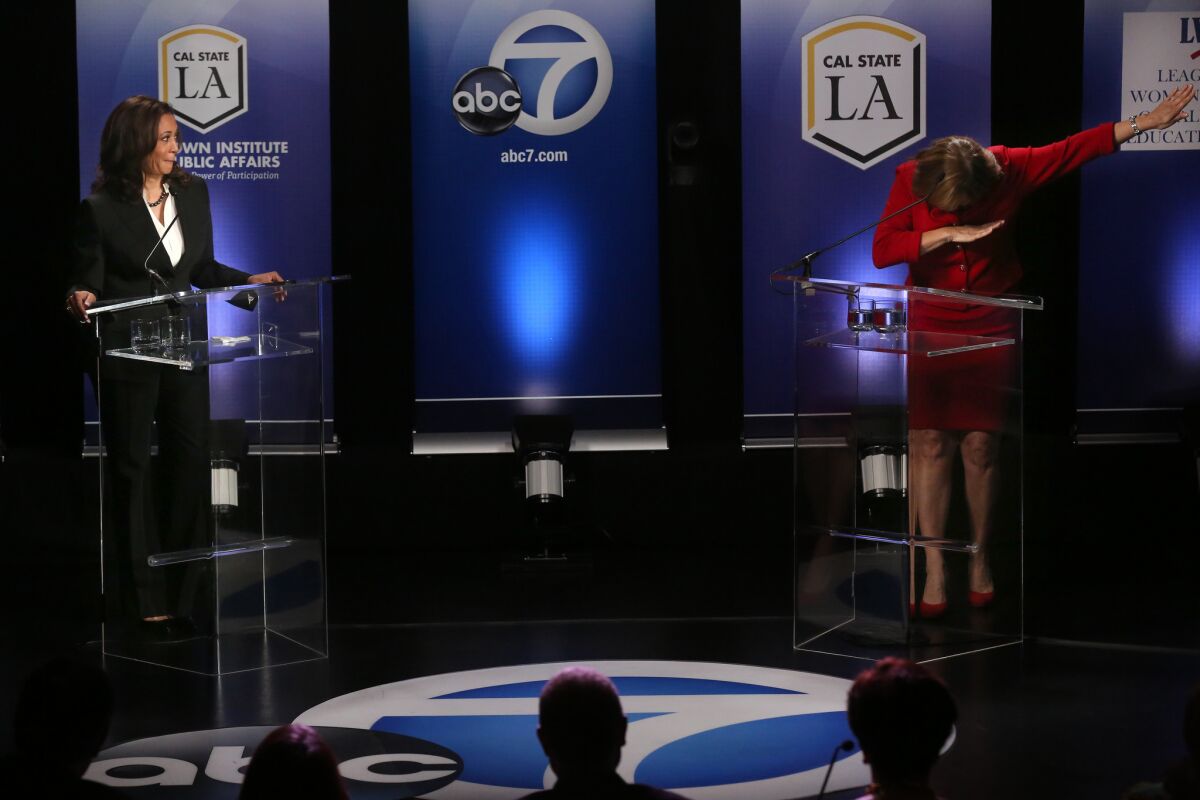Kamala Harris watches as Loretta Sanchez performs a "dab" at the end of her closing statement during their debate last month.