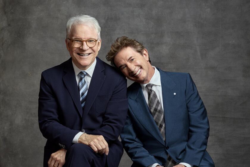 Steve Martin and Martin Short sit next to each other