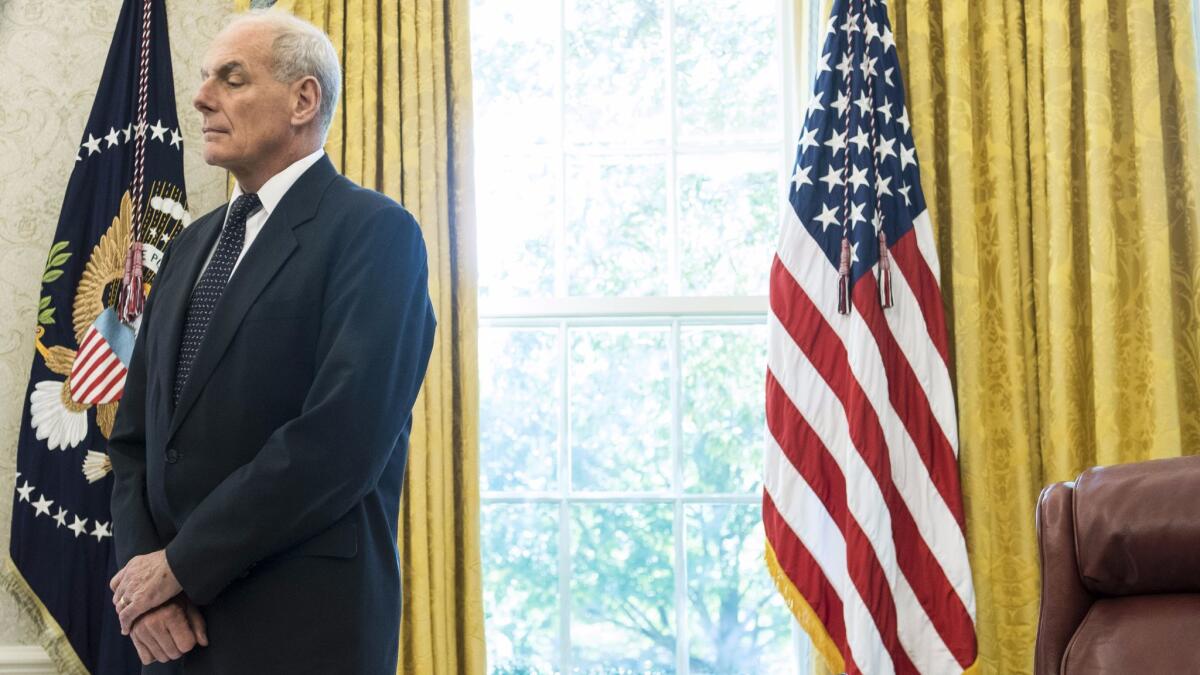 White House Chief of Staff John F. Kelly stands in the Oval Office on Oct. 19.