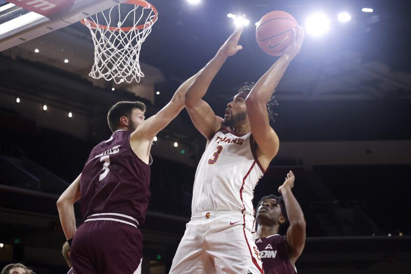 Southern California forward Isaiah Mobley (3) shoots against Eastern Kentucky forward Jannson Williams (3) during the first half of an NCAA college basketball game Tuesday, Dec. 7, 2021, in Los Angeles. (AP Photo/Ringo H.W. Chiu)