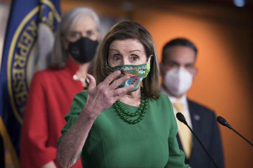 Speaker of the House Nancy Pelosi, D-Calif., meets with reporters before the House votes to pass a $1.9 trillion pandemic relief package, during a news conference at the Capitol in Washington, Friday, Feb. 26, 2021. Pelosi is flanked by Rep. Katherine Clark, D-Mass., left, and Rep. Pete Aguilar, D-Calif. (AP Photo/J. Scott Applewhite)